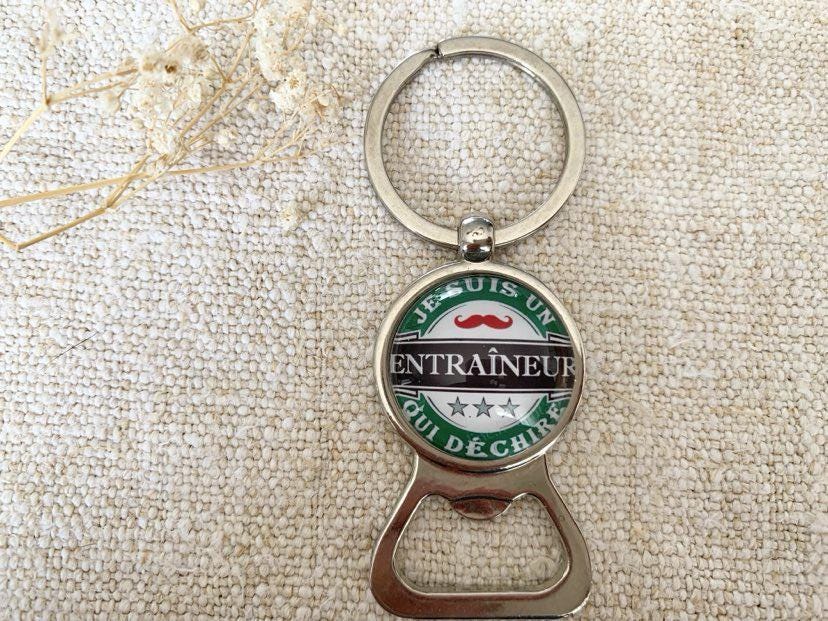 Porte clé décapsuleur je suis un entraineur qui déchire