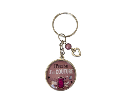 Porte clé cabochon "jpeux pas j'ai couture "