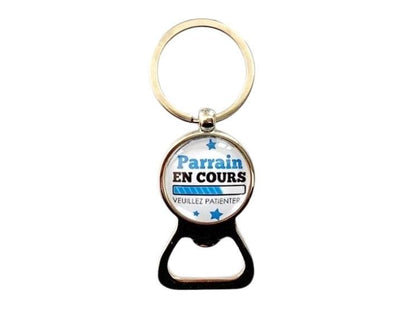 Porte clé décapsuleur annonce naissance, parrain en cours...