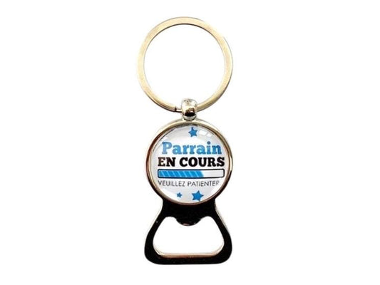 Porte clé décapsuleur annonce naissance, parrain en cours...